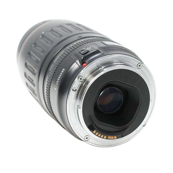 Canon EF mount rear interface of ClubCamera.com 100-300mm lens showing gold contacts and red AF/MF switch indicator