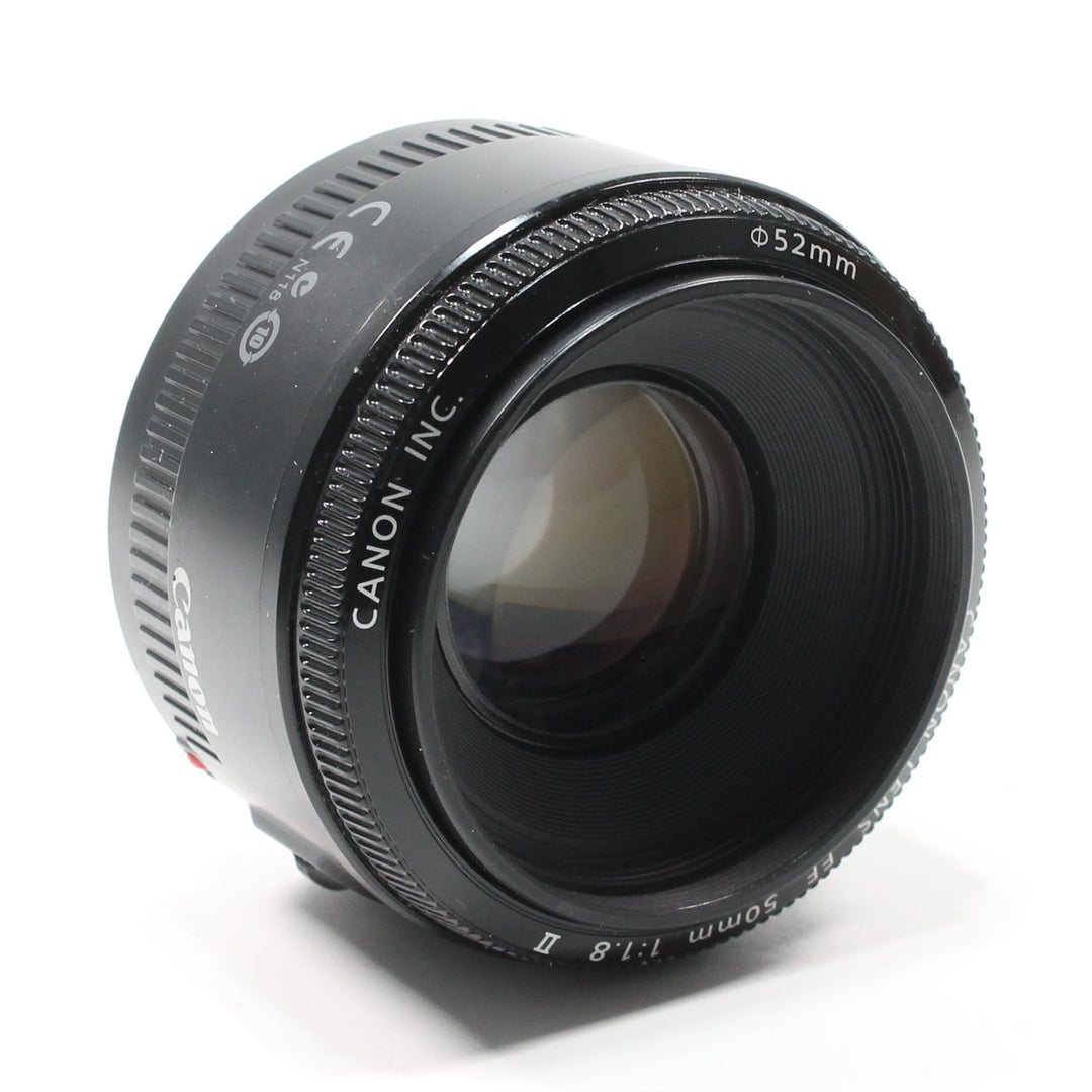 Canon EF 50mm f/1.8 II prime lens matte black barrel with textured focus ring and purple coating at ClubCamera.com