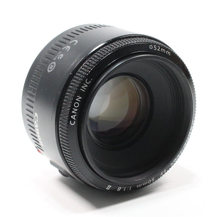 Canon EF 50mm f/1.8 II prime lens matte black barrel with textured focus ring and purple coating at ClubCamera.com