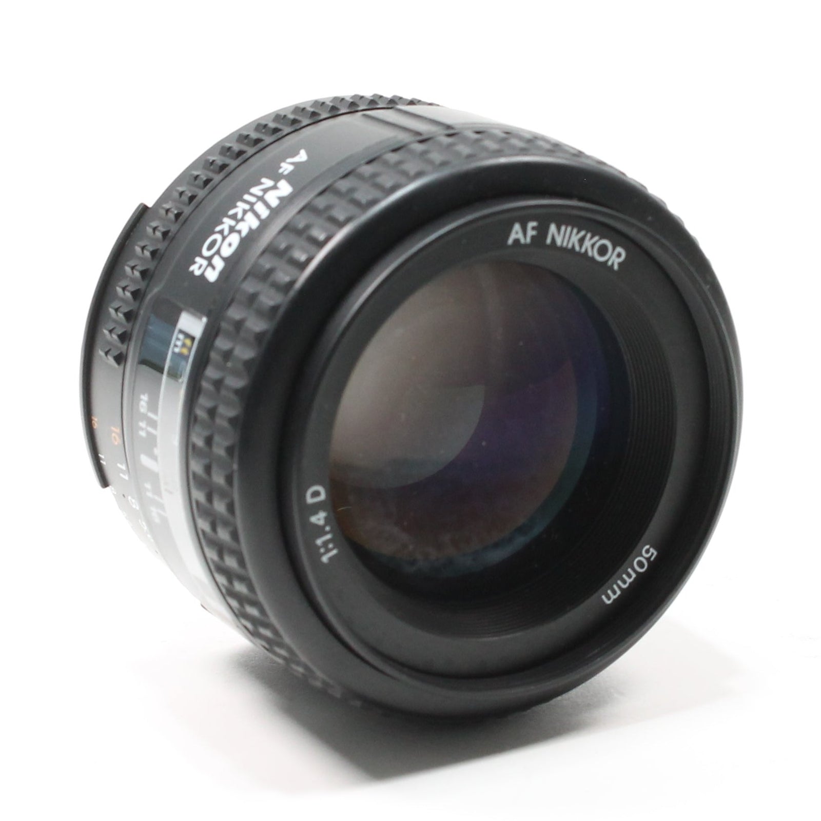 Black Nikon AF Nikkor 50mm f/1.4D lens showing glossy front element and purple-blue coating by ClubCamera.com