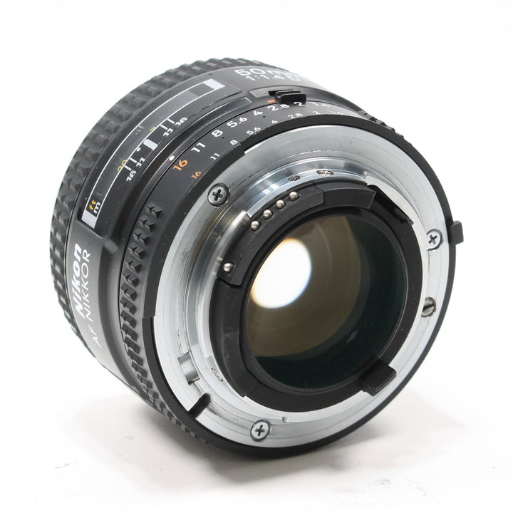 Rear view of Nikon AF Nikkor 50mm f/1.4D F-mount bayonet with silver contacts and FX label by ClubCamera.com