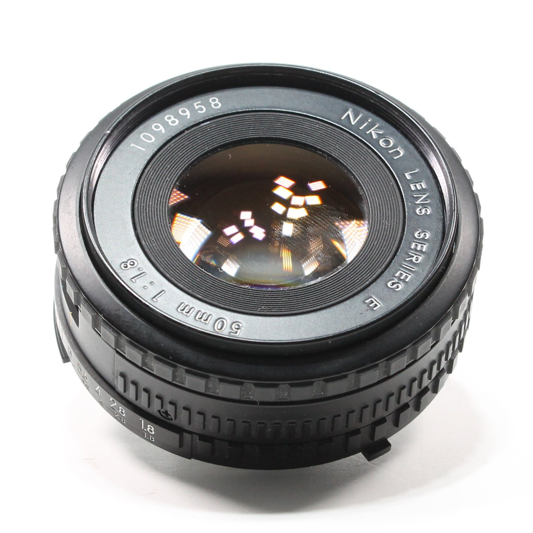 ClubCamera.com front view of black Nikon 50mm f/1.8 Series E prime lens with engraved serial number and ridged focus ring