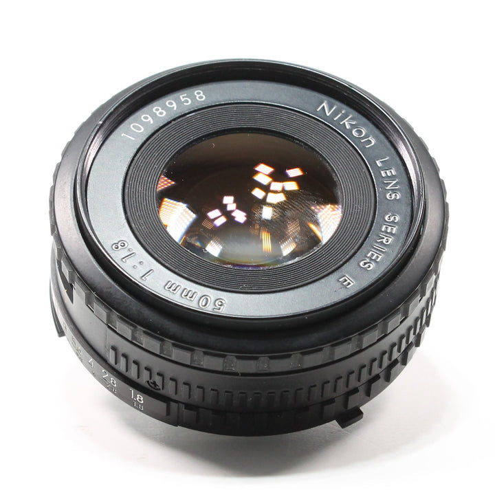 ClubCamera.com front view of black Nikon 50mm f/1.8 Series E prime lens with engraved serial number and ridged focus ring