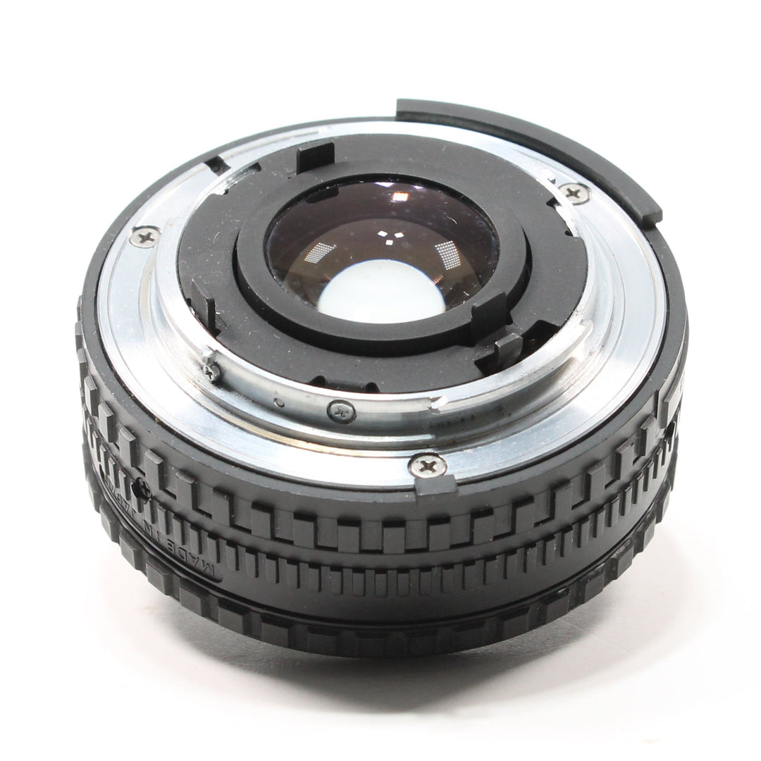 ClubCamera.com Nikon 50mm f/1.8 Series E lens rear view showing MADE IN JAPAN text, metal flange, and rubber grip texture