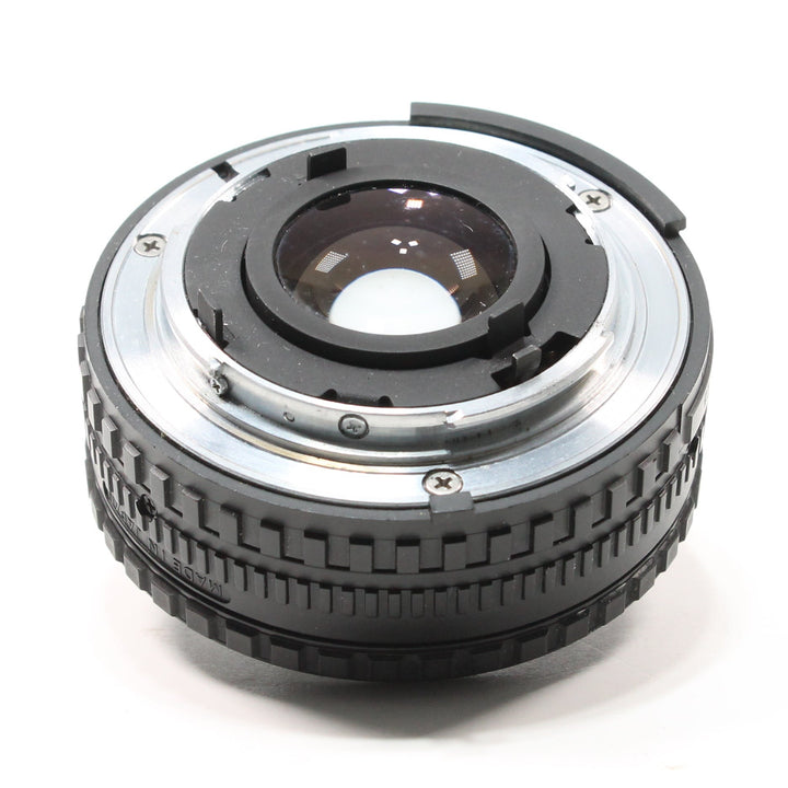 ClubCamera.com Nikon 50mm f/1.8 Series E lens rear view showing MADE IN JAPAN text, metal flange, and rubber grip texture