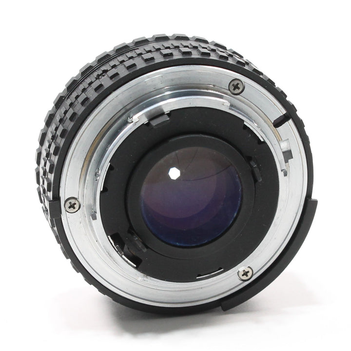ClubCamera.com Nikon Nikkor 50mm f/1.8 manual focus lens rear F-mount bayonet with silver screws and purple-blue coating