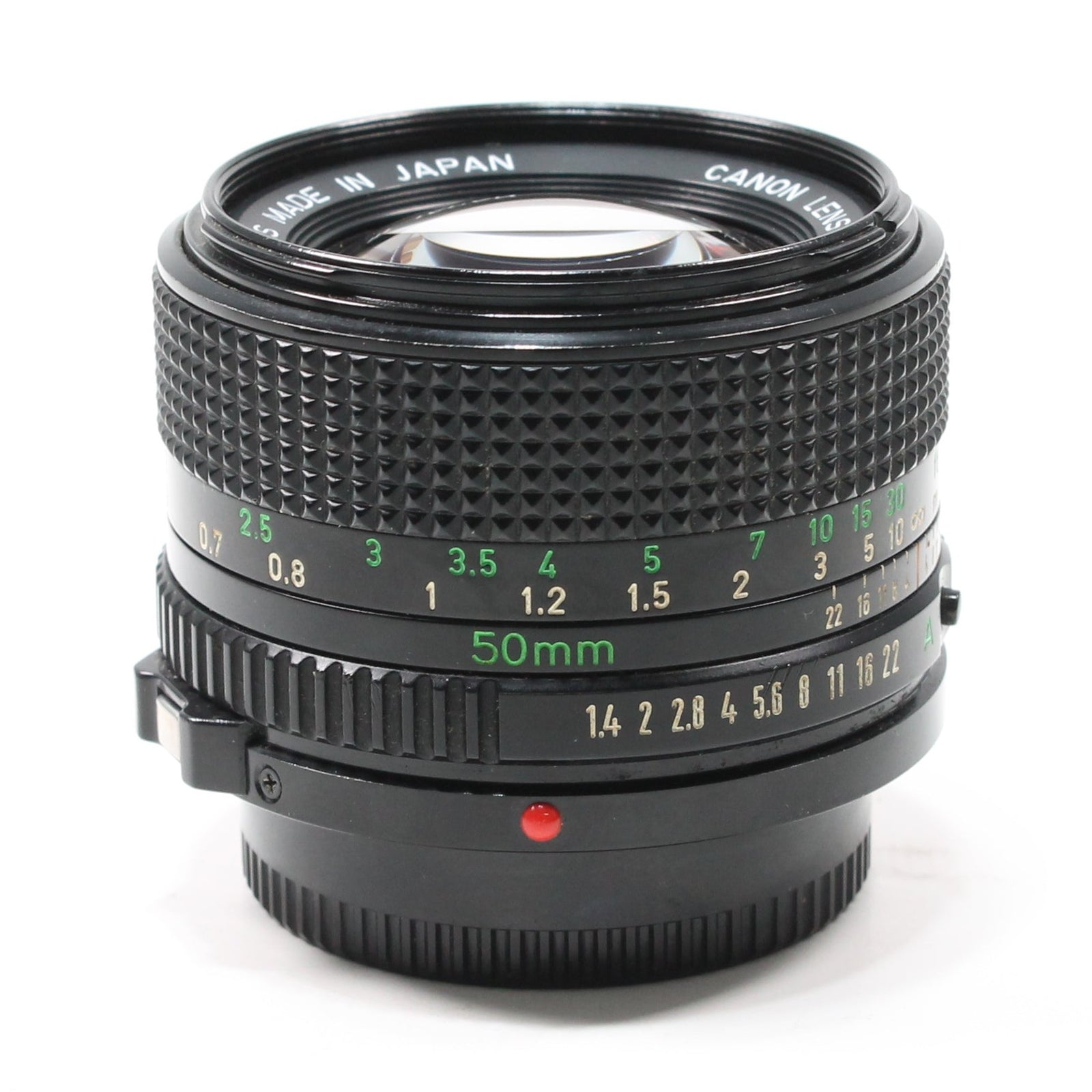 Top view of Canon FD 50mm f/1.4 manual lens at ClubCamera.com with dual-ring design and red index mark