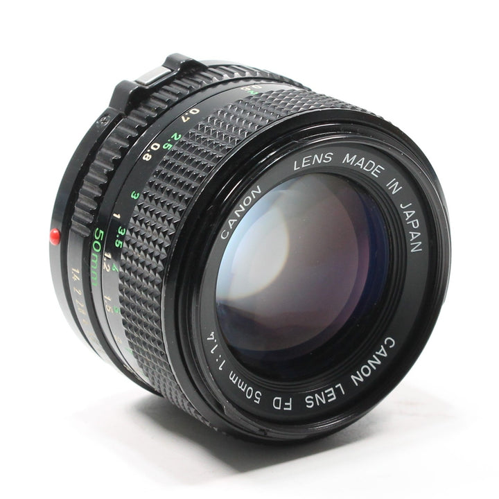 Canon FD 50mm f/1.4 lens at ClubCamera.com showing textured focus ring and green aperture markings