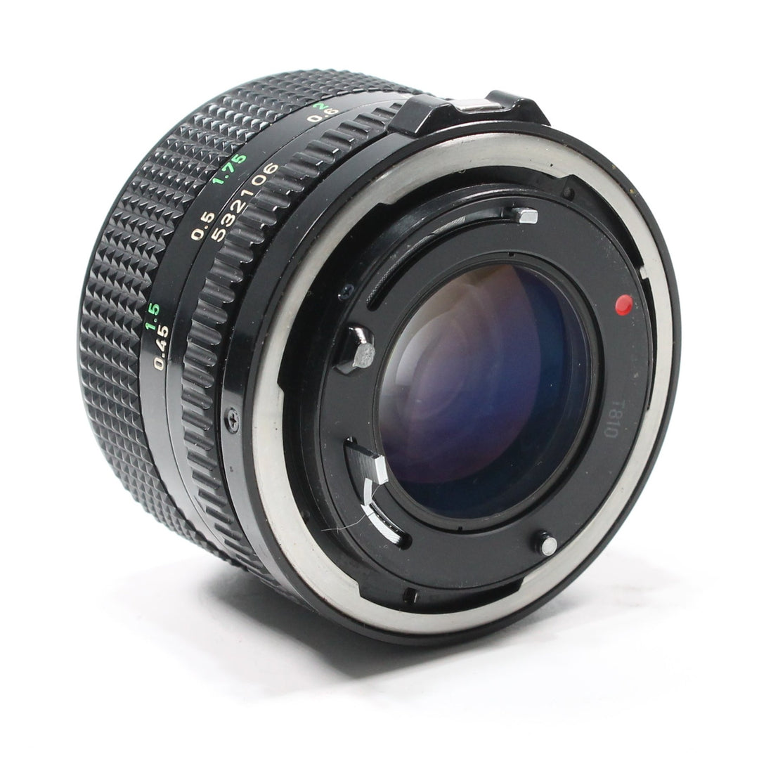 Rear view of Canon FD 50mm f/1.4 lens mount at ClubCamera.com displaying silver metal interface and serial number
