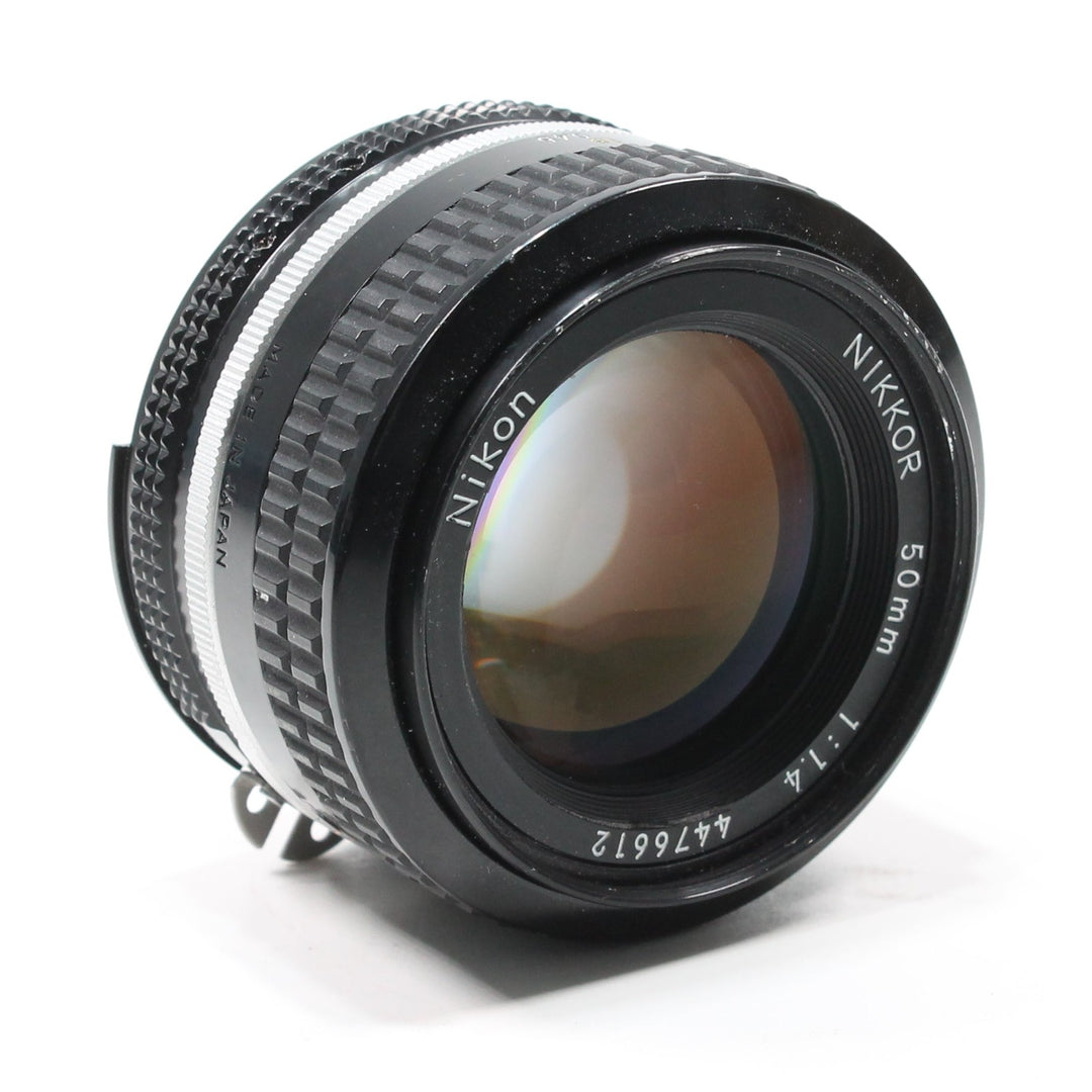 ClubCamera.com Nikon AF Nikkor 50mm f/1.4 lens side view with engraved text and textured focus ring