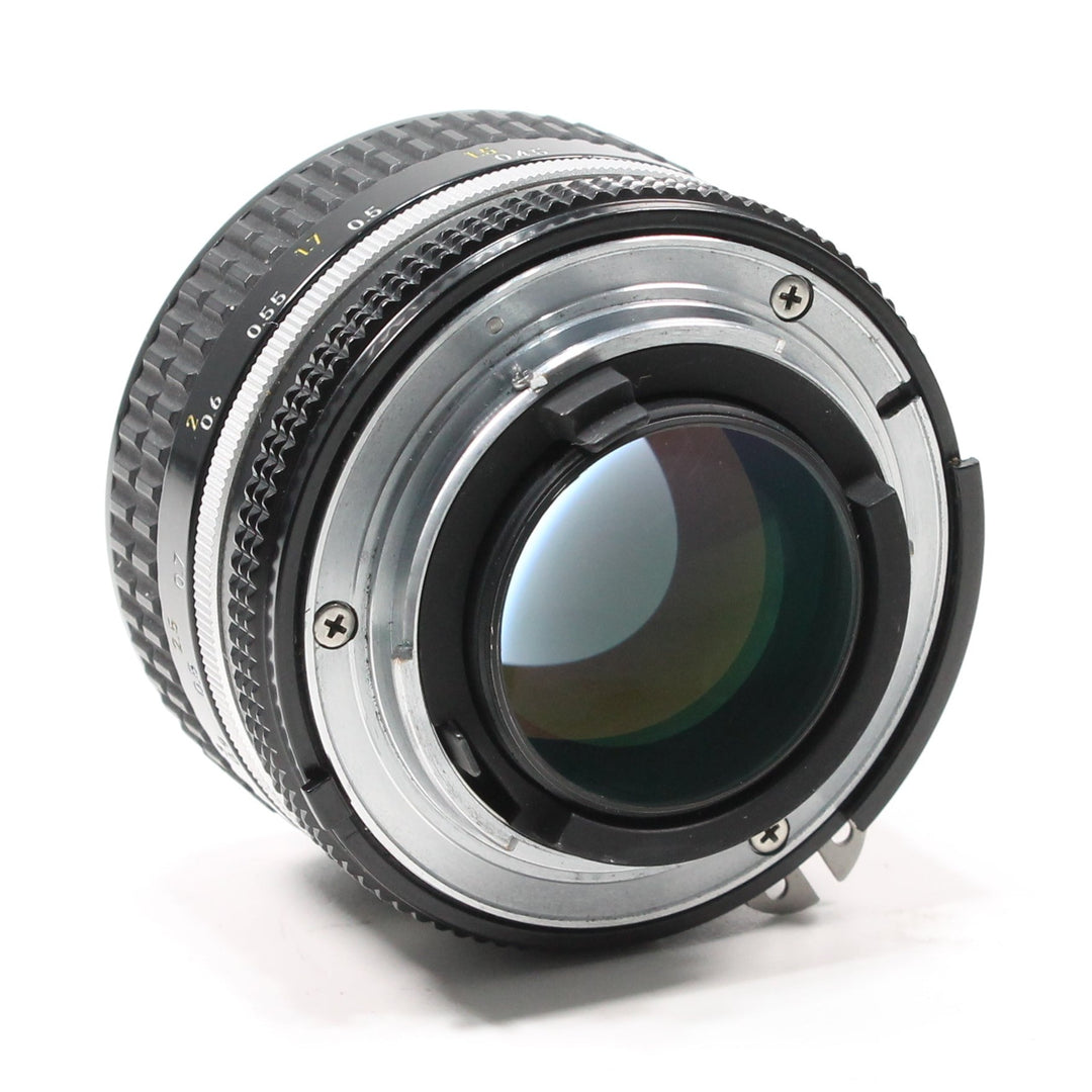 ClubCamera.com rear mount of black Nikon 50mm f/1.4 lens showing silver interface and aperture markings
