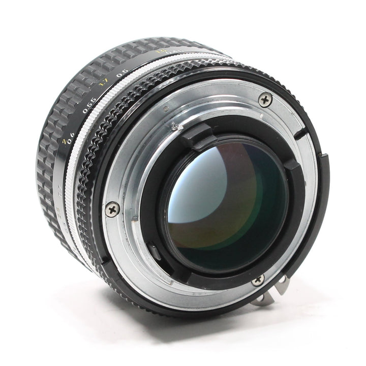 ClubCamera.com rear mount of black Nikon 50mm f/1.4 lens showing silver interface and aperture markings