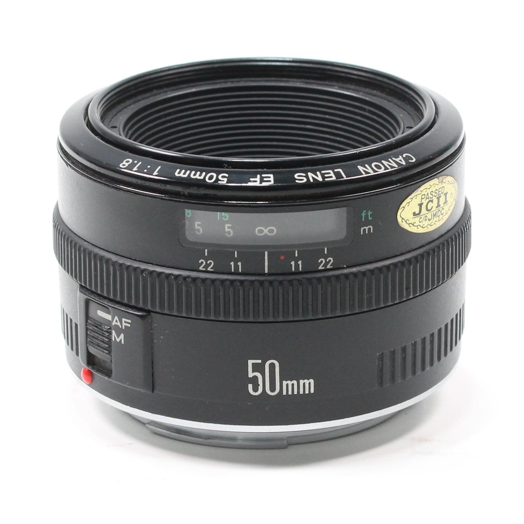 ClubCamera.com Canon EF 50mm f/1.8 prime lens front view with JCIT certification sticker and textured grip rings