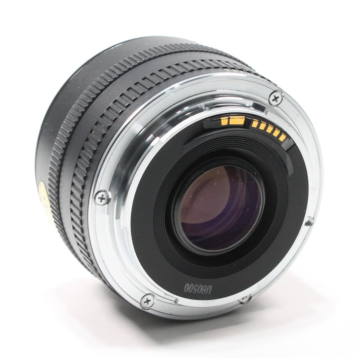 ClubCamera.com Canon EF 50mm f/1.8 rear mount close-up displaying gold electrical contacts and silver metal interface