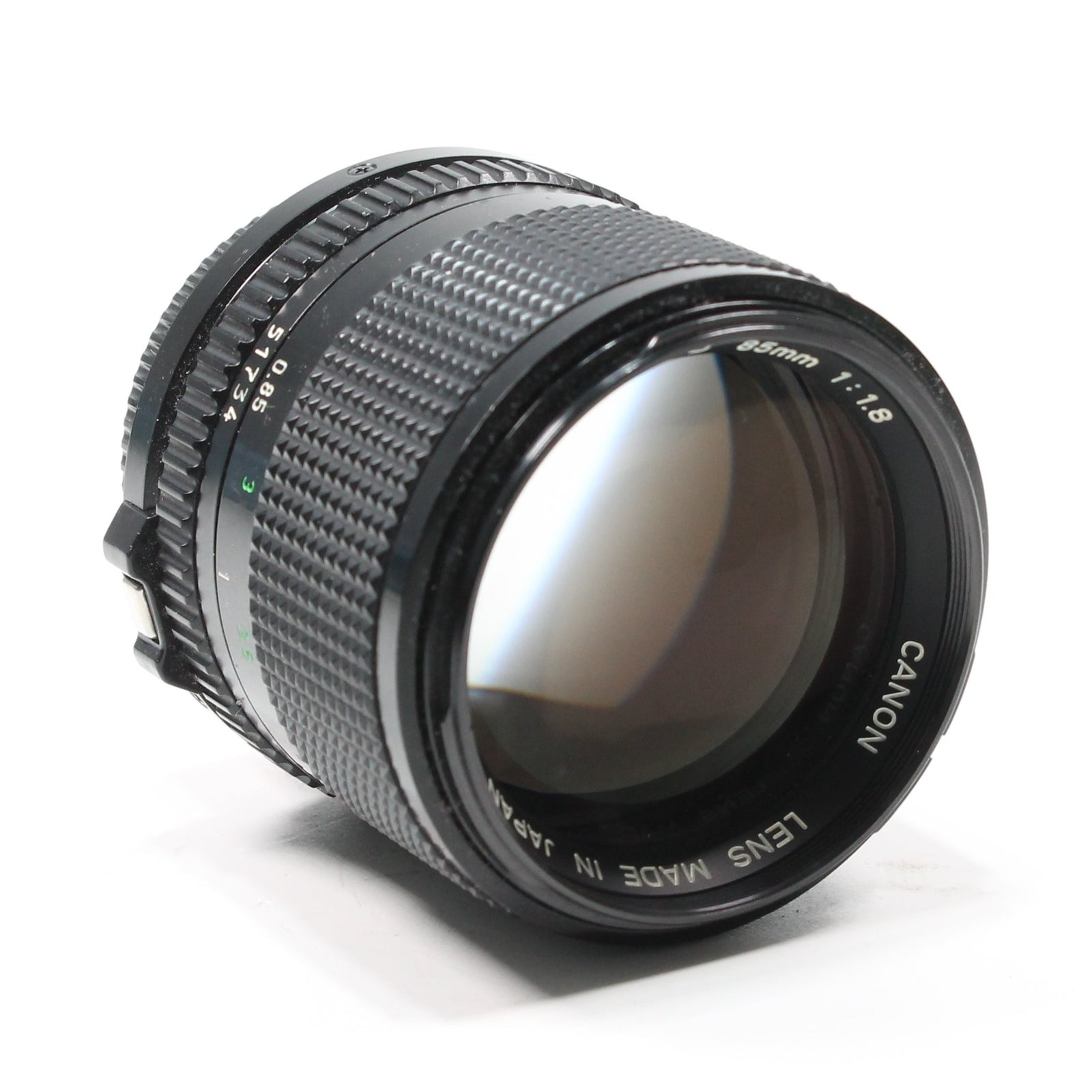 Canon FD 85mm f/1.8 manual focus portrait lens by ClubCamera.com with textured knurled rings and green aperture numerals