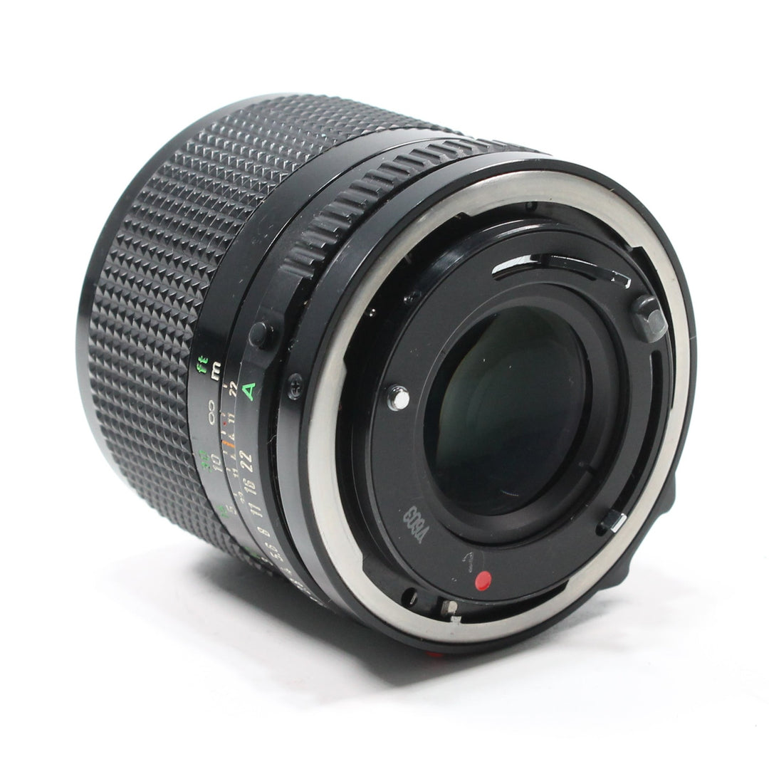Rear view of Canon FD 85mm f/1.8 vintage film lens showing silver FD mount ring and distance scale at ClubCamera.com