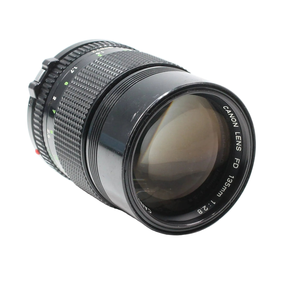 ClubCamera Canon FD 135mm f/2.8 front element angle showing engraved text and red dot