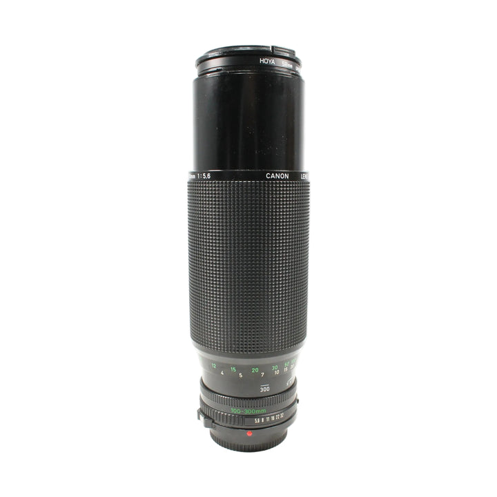 Canon FD 100-300mm f/5.6 manual focus telephoto lens with Hoya filter cap at ClubCamera.com