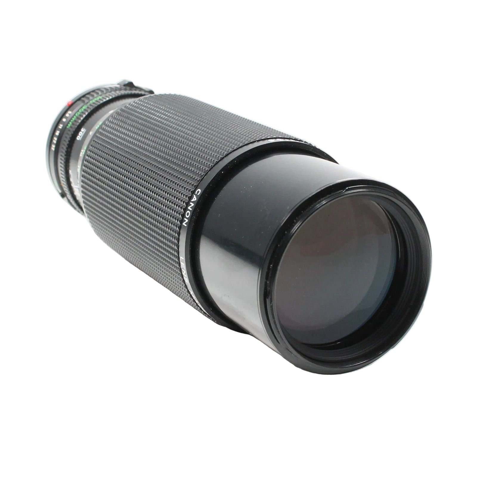 Diagonal view of black Canon FD 100-300mm f/5.6 vintage telephoto zoom lens at ClubCamera.com