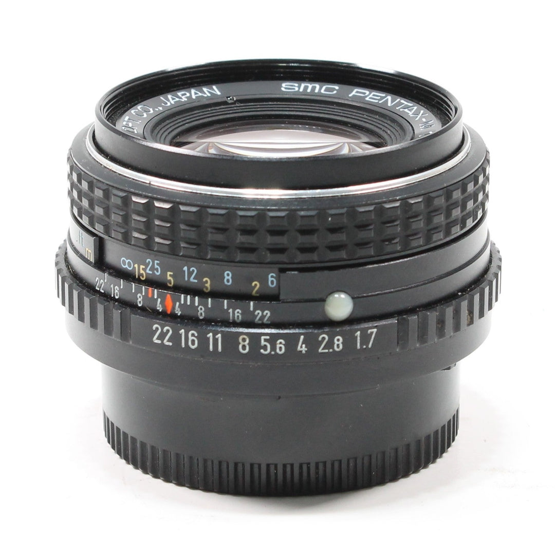 Pentax SMC 50mm f/1.7 manual focus lens by ClubCamera showing engraved aperture ring and ribbed grip texture