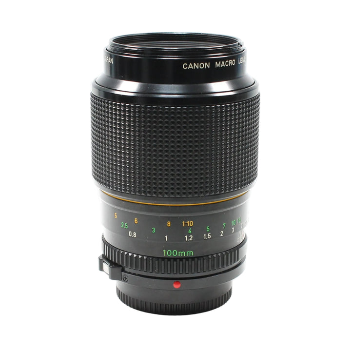 ClubCamera.com Canon FD 100mm macro lens front view with distance scale and red alignment dot