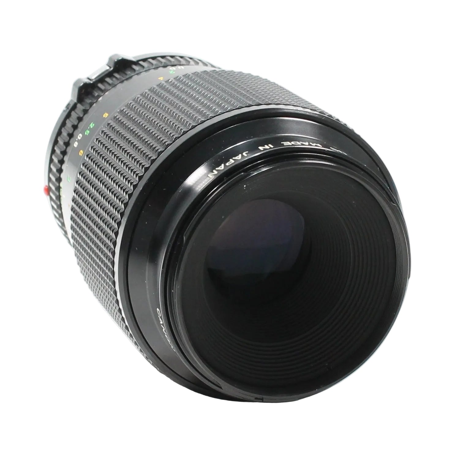 Canon FD 100mm f/4 Macro lens by ClubCamera.com showing ribbed focus ring and MADE IN JAPAN text