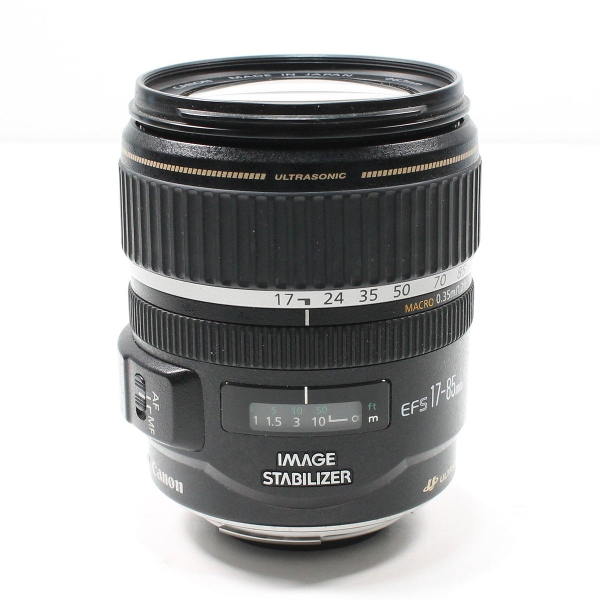 Canon EF-S 17-85mm f/4-5.6 IS USM lens front shot displaying green LCD distance window and Ultrasound motor text at ClubCamera.com
