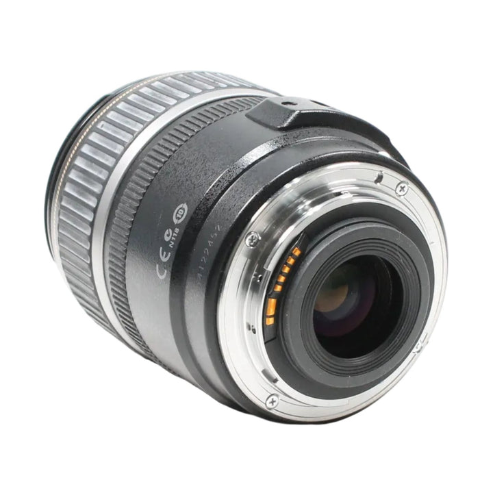 Rear mount view of black Canon EF-S 17-85mm f/4-5.6 IS USM lens revealing gold contact points and bayonet interface from ClubCamera.com