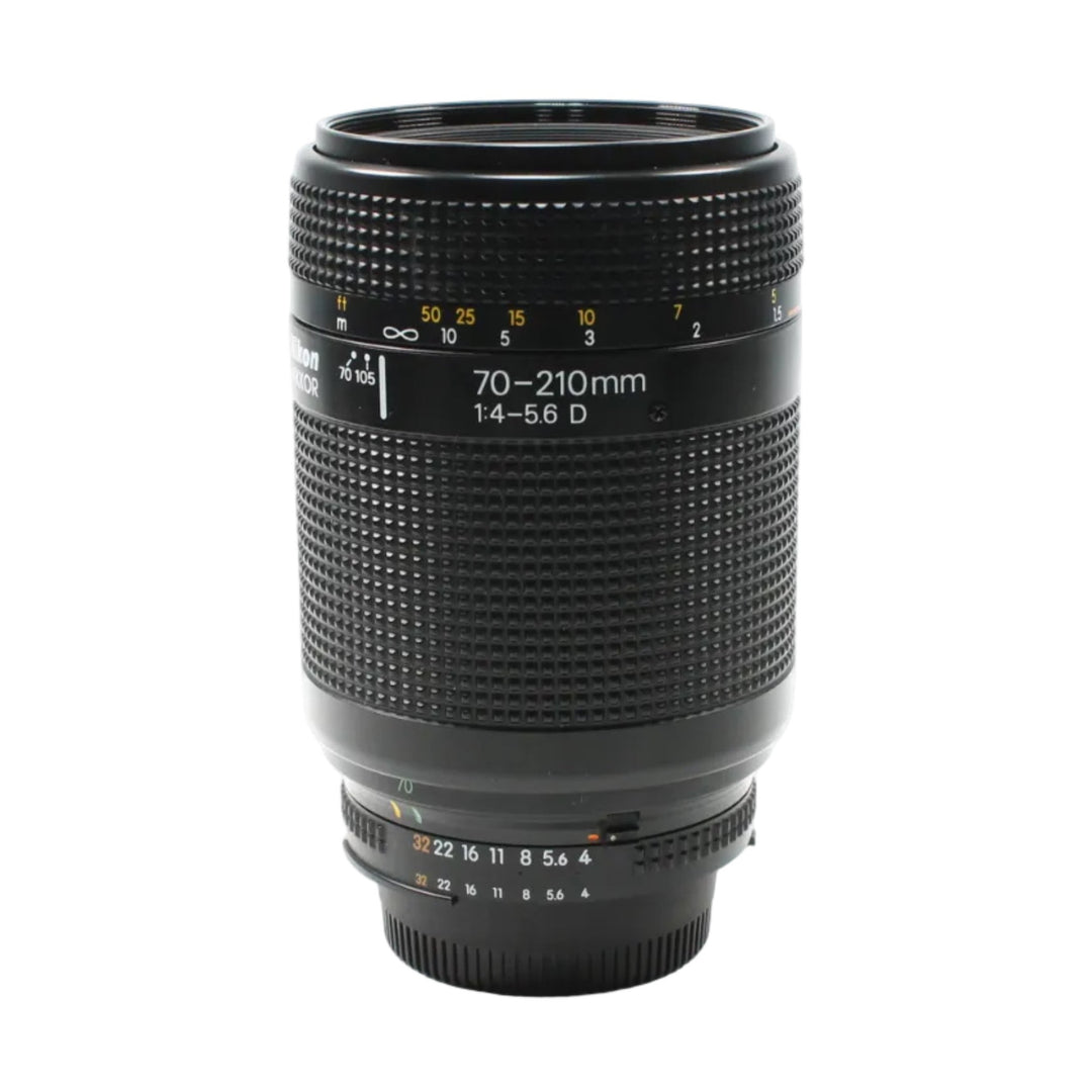 Full shot of Nikon AF Nikkor 70-210mm f/4-5.6D telephoto zoom lens with yellow markers and silver mount from ClubCamera.com