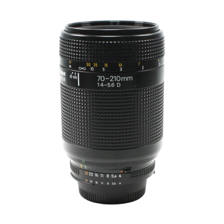 Full shot of Nikon AF Nikkor 70-210mm f/4-5.6D telephoto zoom lens with yellow markers and silver mount from ClubCamera.com