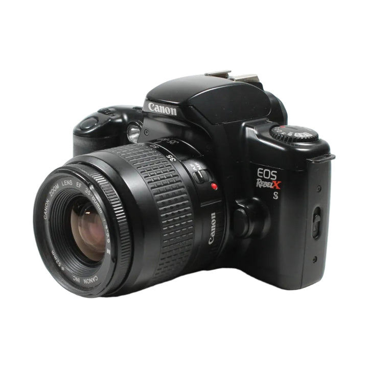 Three-quarter angle of Canon EOS Rebel XS showing mode dial and grip