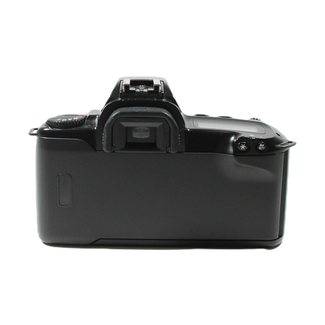 Rear view of black Canon EOS Rebel XS SLR battery compartment and controls