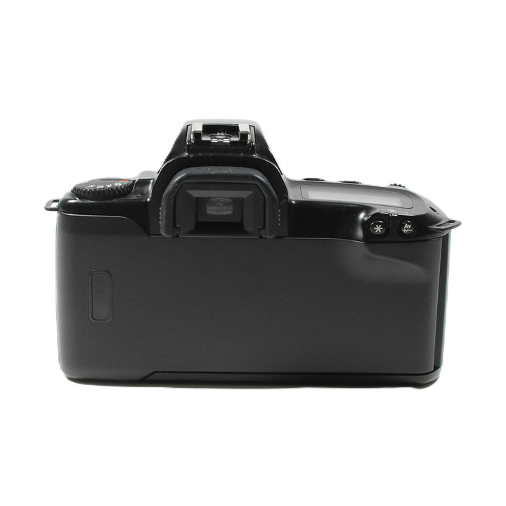 Rear view of black Canon EOS Rebel XS SLR battery compartment and controls