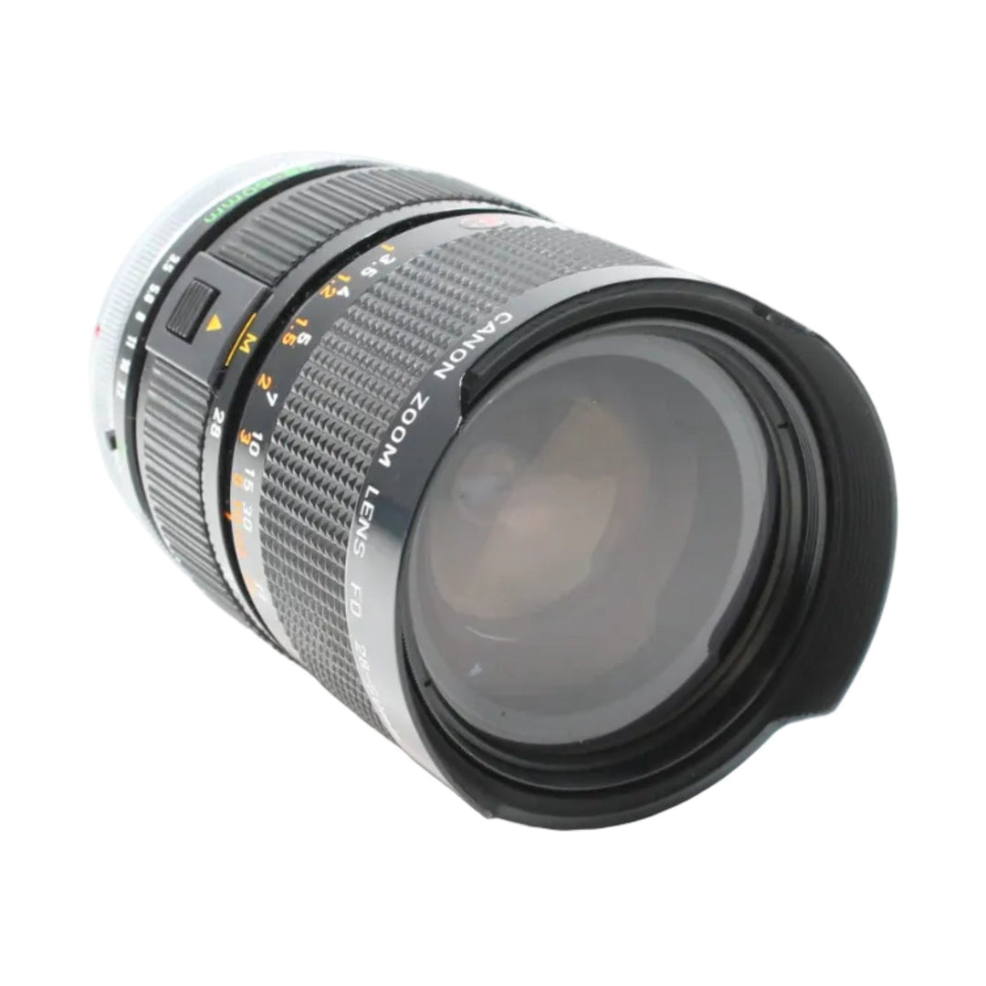 Canon FD 28-50mm f/3.5 lens with petal hood and orange aperture scale at ClubCamera.com
