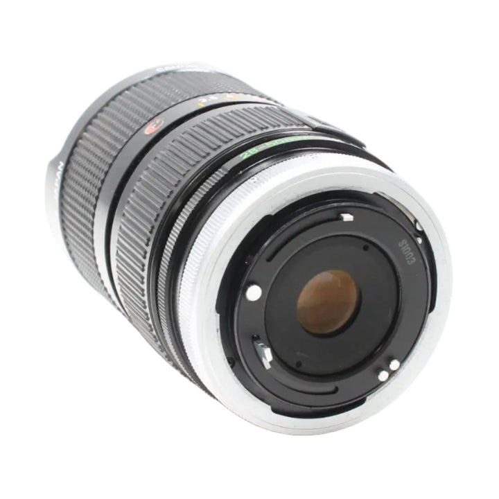 Rear view of Canon FD mount interface with silver metal pins and S1003 marking at ClubCamera.com