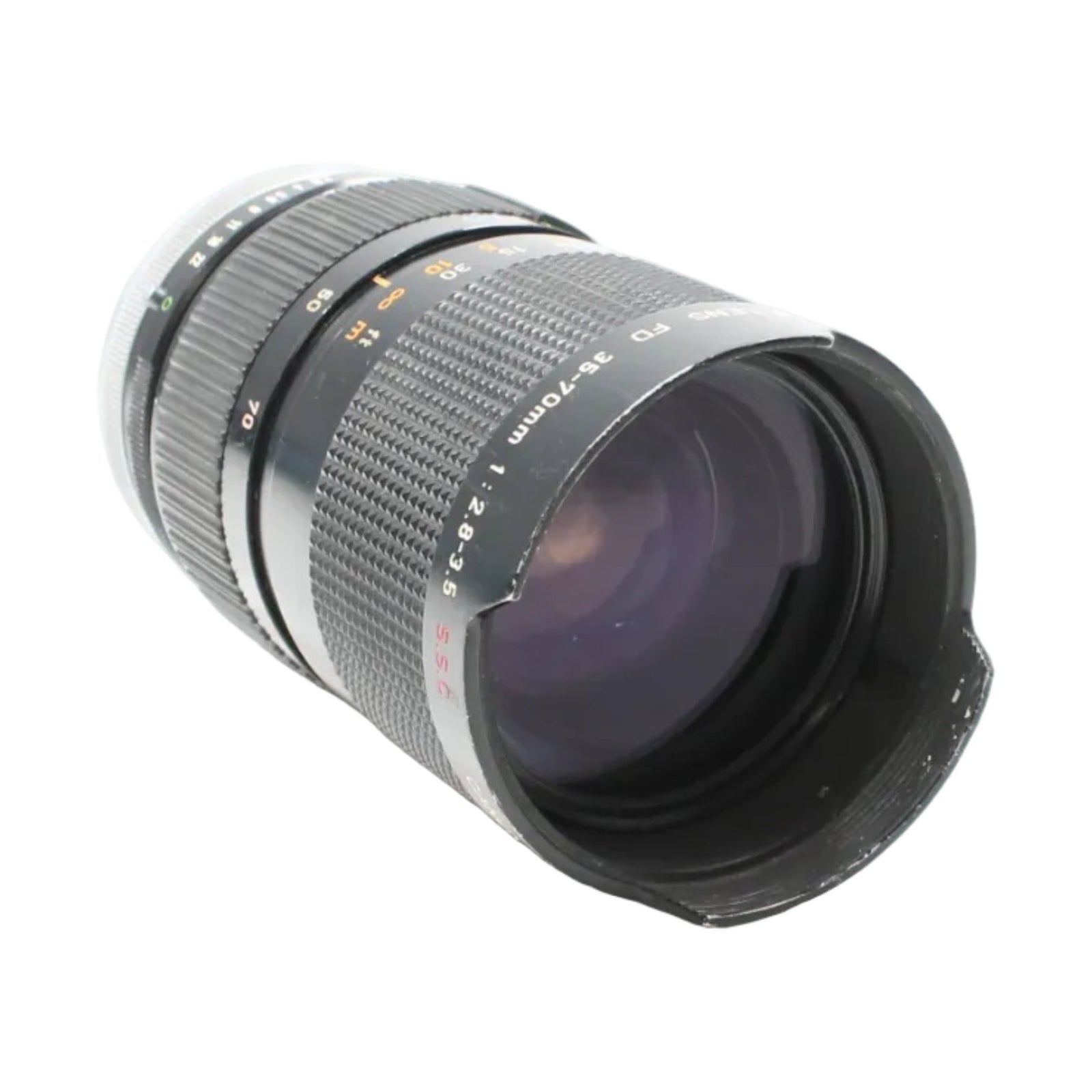 Black Canon FD 35-70mm lens by ClubCamera showing purple anti-reflective coating and compact cylindrical form