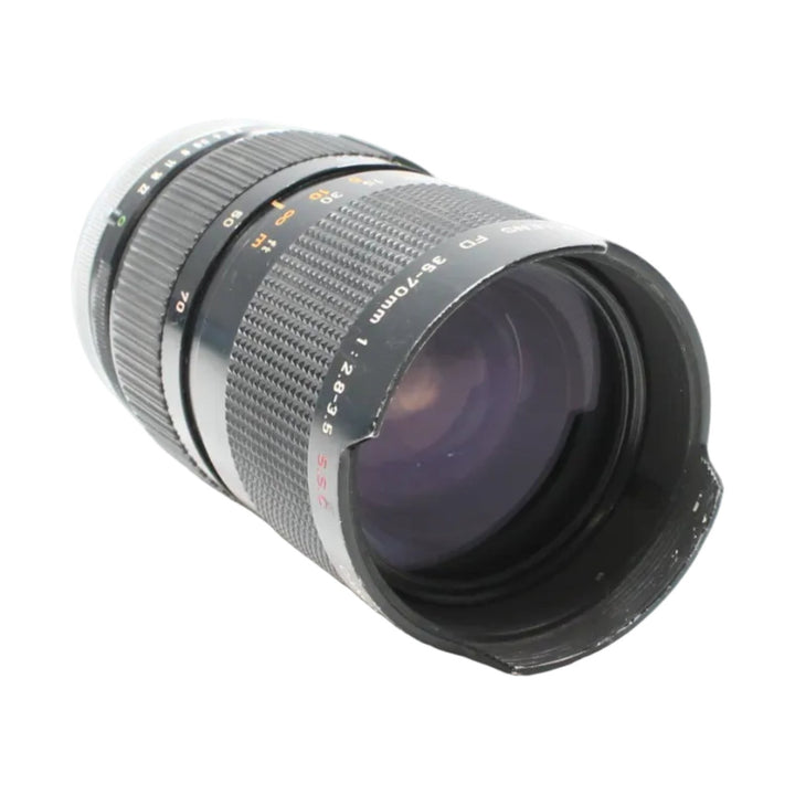 Black Canon FD 35-70mm lens by ClubCamera showing purple anti-reflective coating and compact cylindrical form