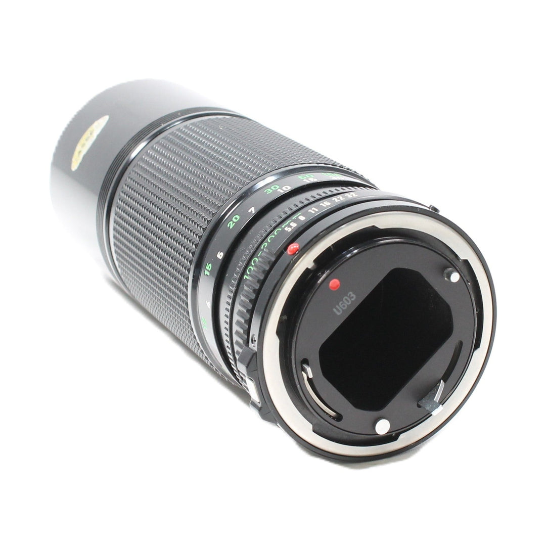 Rear view of Canon FD mount 100-200mm f/5.6 telephoto zoom lens at ClubCamera.com revealing bayonet interface and screws