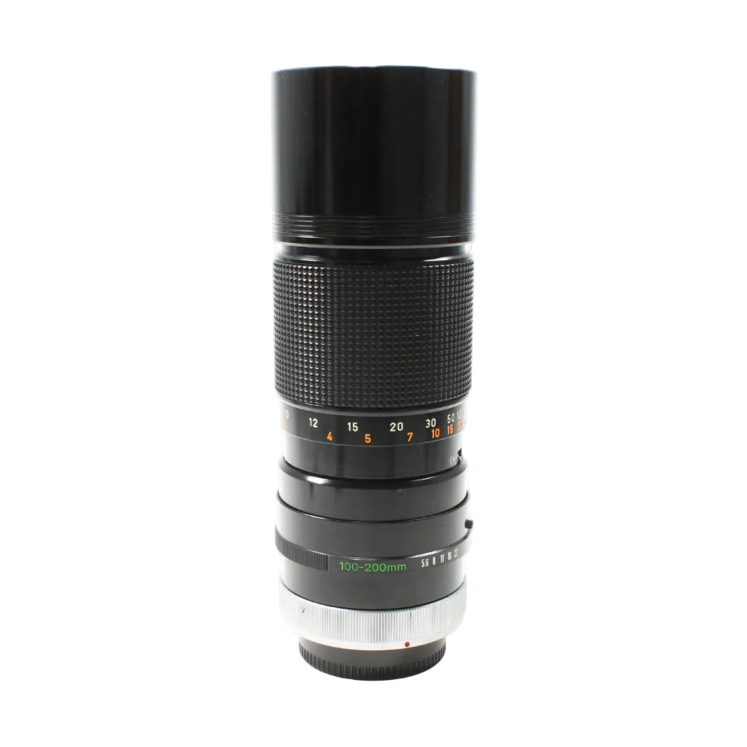 ClubCamera vintage black Canon FD 100-200mm f/5.6 manual focus lens with diamond grip and red dot