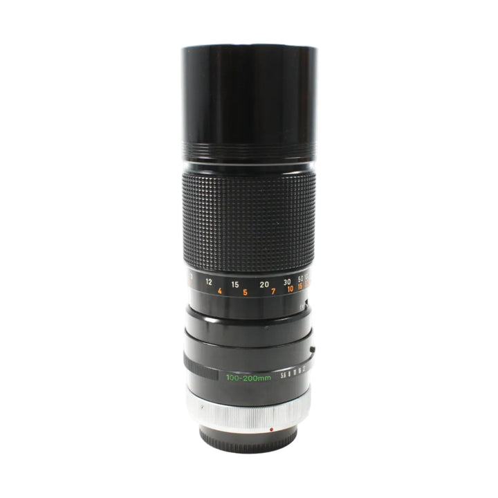 ClubCamera vintage black Canon FD 100-200mm f/5.6 manual focus lens with diamond grip and red dot