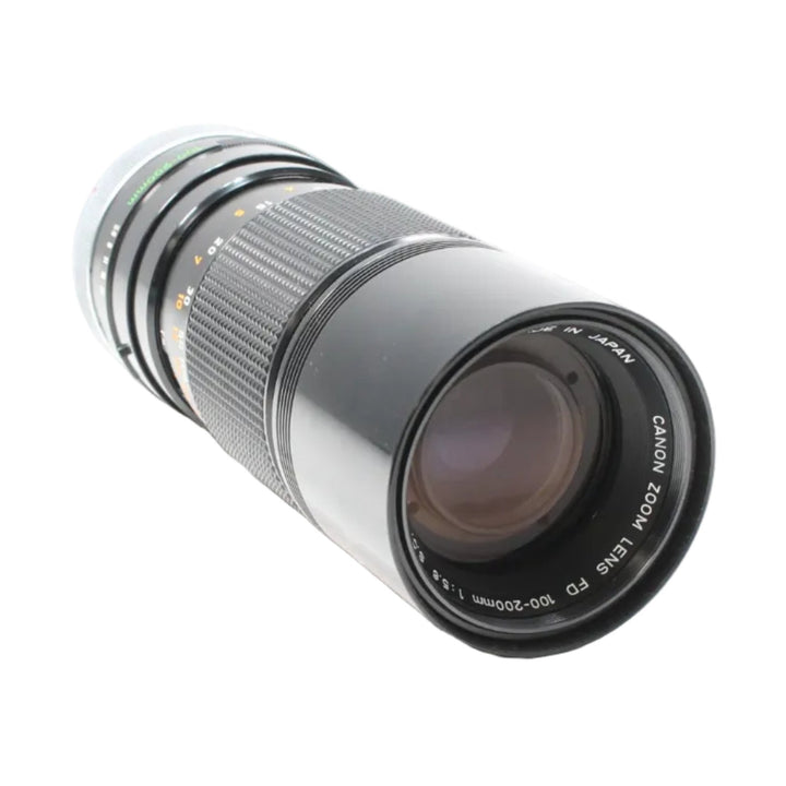 ClubCamera Canon FD 100-200mm f/5.6 telephoto lens front glass with purple coating and orange scale