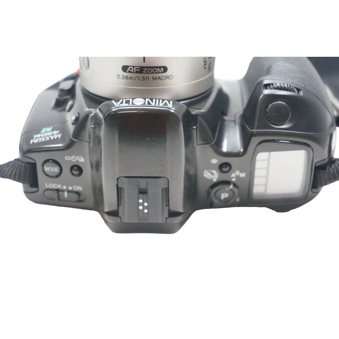 ClubCamera.com top view of Minolta Maxxum 430si showing mode dial, hot shoe, and LCD panel controls