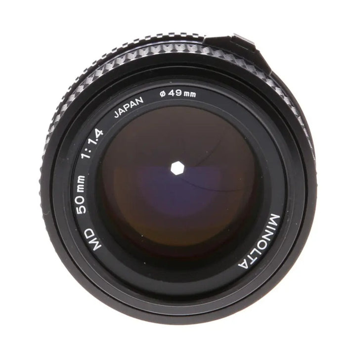 ClubCamera.com front view of Minolta 50mm f/1.4 MD lens showing purple coating and engraved specs