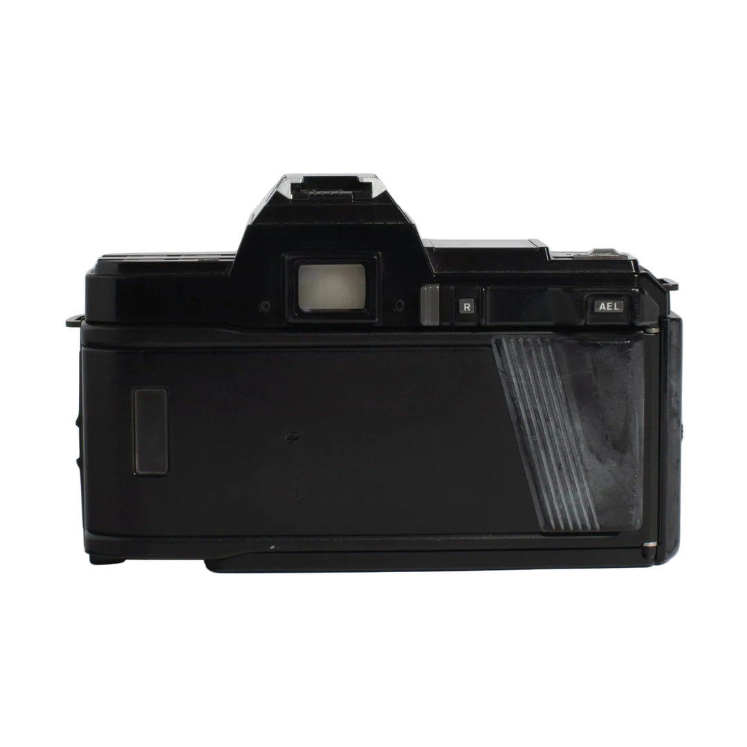 Back view of black Minolta 7000 SLR film camera with ribbed grip and LCD panel at ClubCamera.com