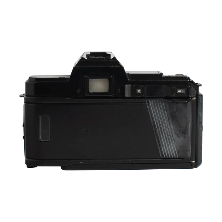 Back view of black Minolta 7000 SLR film camera with ribbed grip and LCD panel at ClubCamera.com