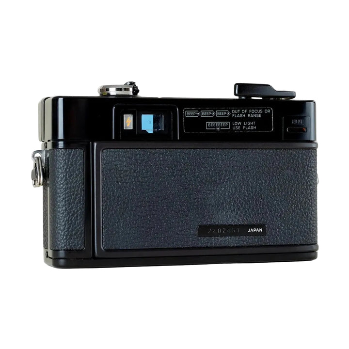 Rear of black Minolta Hi-Matic AF2 showing autofocus window and focus alert labels from ClubCamera.com