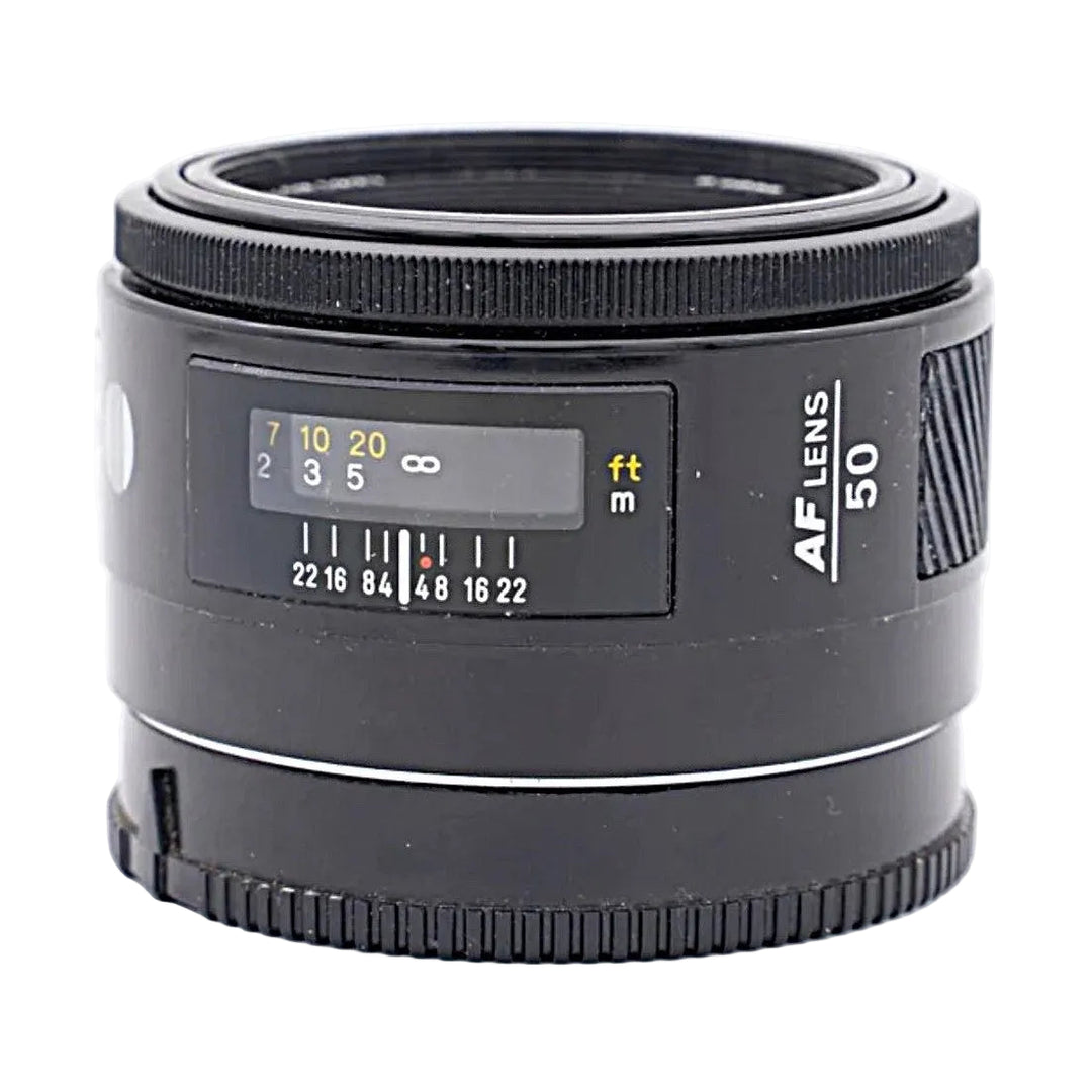 Minolta AF 50mm F1.7 lens side view with focus distance window and rubber grip rings at ClubCamera.com