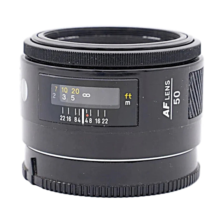 Minolta AF 50mm F1.7 lens side view with focus distance window and rubber grip rings at ClubCamera.com