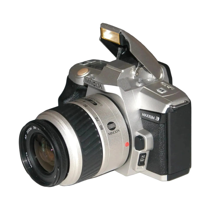 Minolta Maxxum 3 SLR film camera kit with AF Zoom lens at ClubCamera.com showing raised flash and silver black body