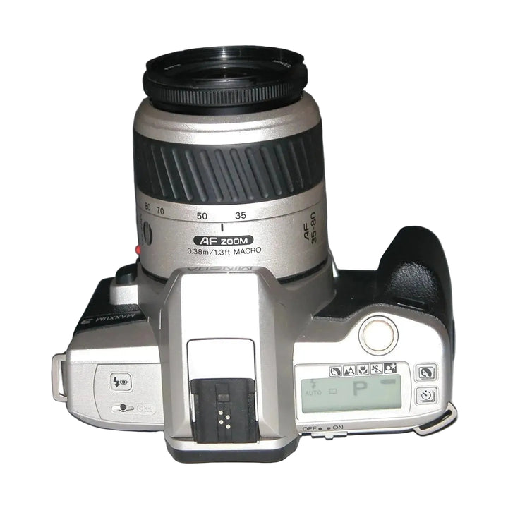Top view of Minolta Maxxum 3 SLR camera controls LCD P mode and focus ring at ClubCamera.com